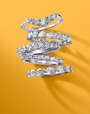 Assortment of stackable diamond wedding rings.